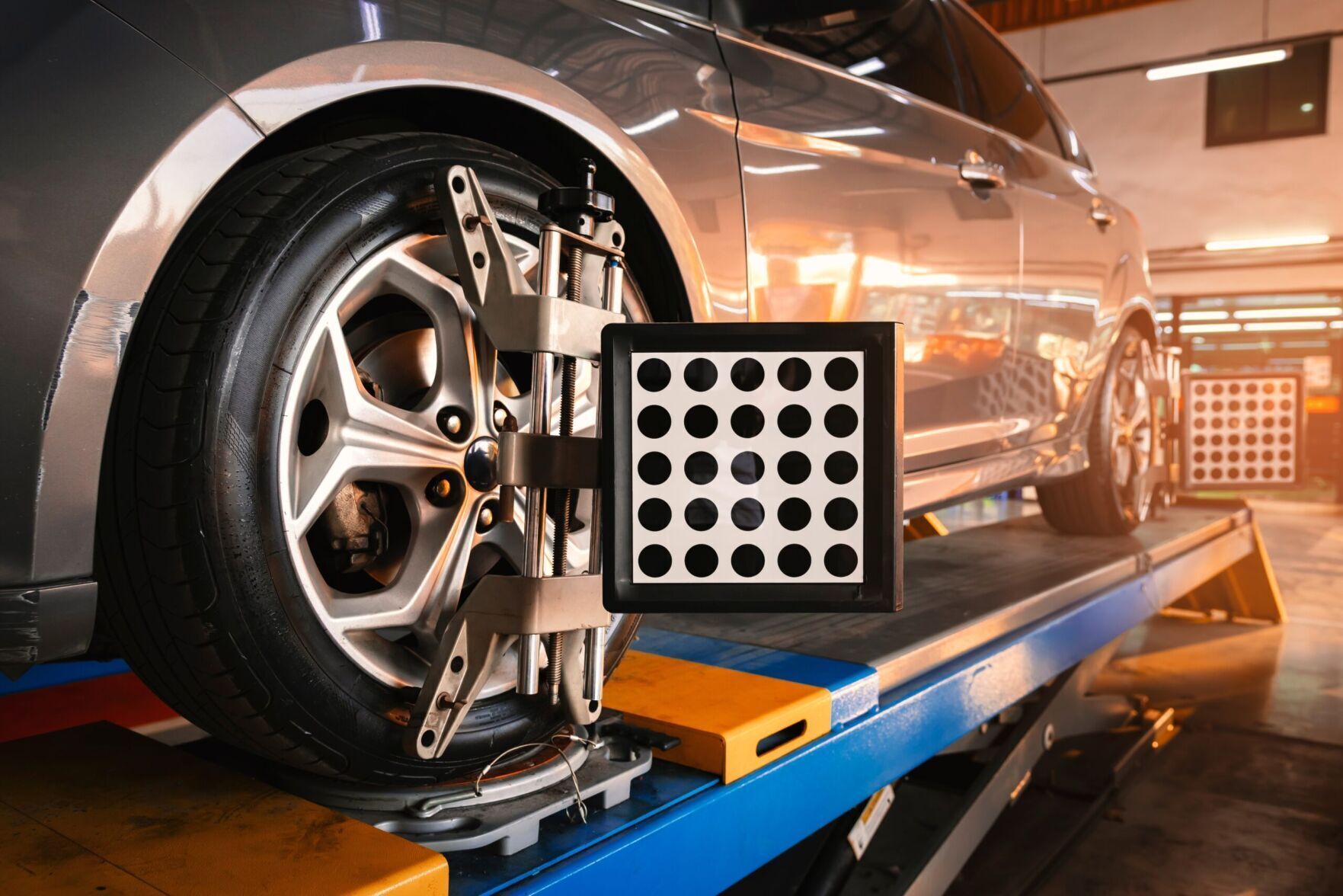 Car wheel alignment in progress